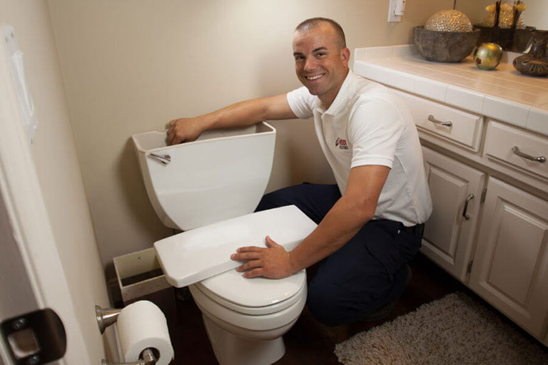 Raby Technician Fixing Toilet